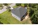 Aerial view of backyard with gray siding and patio at 204 Trevor Ridge Dr, Holly Springs, NC 27540