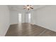 This spacious bedroom with modern vinyl floors features multiple doors leading to other parts of the home at 204 Trevor Ridge Dr, Holly Springs, NC 27540