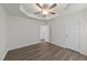 This is a spacious bedroom featuring vinyl floors and multiple doors at 204 Trevor Ridge Dr, Holly Springs, NC 27540