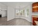 Open dining room features hardwood floors and lots of natural light at 204 Trevor Ridge Dr, Holly Springs, NC 27540