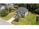 Charming two-story home featuring gray siding, a well-manicured lawn, and a long driveway at 204 Trevor Ridge Dr, Holly Springs, NC 27540