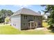 Rear exterior elevation of house with patio and lawn at 204 Trevor Ridge Dr, Holly Springs, NC 27540