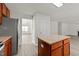 Open kitchen with island flows to the living room at 204 Trevor Ridge Dr, Holly Springs, NC 27540