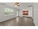Living room with hardwood floors leads to kitchen at 204 Trevor Ridge Dr, Holly Springs, NC 27540
