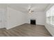 Open living room with hardwood floors and a fireplace at 204 Trevor Ridge Dr, Holly Springs, NC 27540