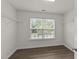 Walk-in closet featuring built-in shelving for organization, with a window offering natural light at 204 Trevor Ridge Dr, Holly Springs, NC 27540