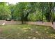 Expansive backyard featuring a new wooden fence providing privacy and a safe play area at 205 S Pettigrew St, Raleigh, NC 27610