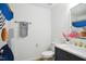 Stylish bathroom with a dark vanity, white marble countertop, and modern fixtures at 205 S Pettigrew St, Raleigh, NC 27610
