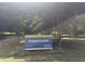 Park sign in Roberts Park, Raleigh with park information and amenities at 205 S Pettigrew St, Raleigh, NC 27610