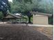 Outdoor picnic area with sheltered tables and barbecue grills for community gatherings at 205 S Pettigrew St, Raleigh, NC 27610