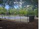 Fenced tennis courts with green and blue surfaces, perfect for tennis enthusiasts at 205 S Pettigrew St, Raleigh, NC 27610