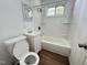 Standard bathroom with tub, toilet, and sink at 2131 Dandridge Dr, Raleigh, NC 27610
