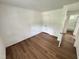 Bedroom with wood-look floors, closet, and light-colored walls at 2131 Dandridge Dr, Raleigh, NC 27610