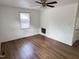 Simple bedroom featuring hardwood floors and natural light at 2131 Dandridge Dr, Raleigh, NC 27610