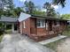 Brick home with covered carport and front porch at 2131 Dandridge Dr, Raleigh, NC 27610