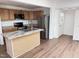Bright kitchen featuring stainless steel appliances and a breakfast bar at 2131 Dandridge Dr, Raleigh, NC 27610