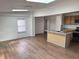 View of home's hardwood flooring, skylights, and open kitchen concept at 2131 Dandridge Dr, Raleigh, NC 27610