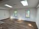 Open floor plan with hardwood flooring and large skylights at 2131 Dandridge Dr, Raleigh, NC 27610