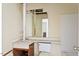 Bathroom with a mirror, sink, and toilet at 2308 Stonesthrow Ct, Raleigh, NC 27610