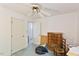 Bedroom featuring a ceiling fan, two doors, and a view to another room at 2308 Stonesthrow Ct, Raleigh, NC 27610