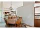 Dining room adjacent to kitchen, showing some damage and boxes stored near the wall at 2308 Stonesthrow Ct, Raleigh, NC 27610