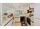 Kitchen with white countertops and cabinets, featuring a black dishwasher and a double sink at 2308 Stonesthrow Ct, Raleigh, NC 27610