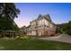 Beautiful backyard featuring a two-story home with a patio and a separate covered outdoor seating area at 233 Hein Dr, Clayton, NC 27527