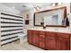 Bathroom with double sink vanity, tiled floors, and shower with striped curtain at 233 Hein Dr, Clayton, NC 27527