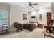 Modern bedroom featuring a black bed frame, cozy chair and neutral colors at 233 Hein Dr, Clayton, NC 27527