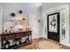 Bright foyer featuring hardwood floors, console table, and a front door with decorative sidelights at 233 Hein Dr, Clayton, NC 27527