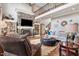 Spacious living room with a stone fireplace, high ceilings, and a comfortable seating area at 233 Hein Dr, Clayton, NC 27527