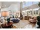 Bright and airy living room with a cozy seating area, hardwood floors, and large windows at 233 Hein Dr, Clayton, NC 27527