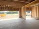 Two-car garage featuring a concrete slab floor and framed walls at 236 Golfview Ave, Benson, NC 27504