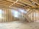 Interior framing showcases stairs, windows, and visible utilities in new construction at 236 Golfview Ave, Benson, NC 27504
