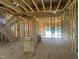 Open concept floor plan featuring framed walls, stairs and visible utilities at 236 Golfview Ave, Benson, NC 27504