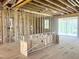 Open concept floor plan framed, with studs and utilities visible at 236 Golfview Ave, Benson, NC 27504