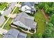 An aerial view shows a home's roof, lawn and landscaping, along with neighboring homes at 2409 Plowridge Rd, Fuquay Varina, NC 27526