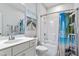 Bright bathroom with a white vanity, a shower-tub combination with a beach-themed curtain at 2409 Plowridge Rd, Fuquay Varina, NC 27526