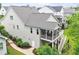 Aerial view of the home featuring a screened-in porch and tiered decks in a residential neighborhood at 2409 Plowridge Rd, Fuquay Varina, NC 27526