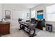 Bright home office with a large desk, artwork, and a comfortable executive chair at 2409 Plowridge Rd, Fuquay Varina, NC 27526