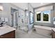 Luxurious bathroom featuring a freestanding tub, walk-in shower, and elegant fixtures at 249 Lindo Johnson Rd, Pittsboro, NC 27312