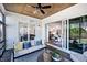 Cozy screened porch with comfortable seating, wood ceiling, and seamless indoor-outdoor flow at 249 Lindo Johnson Rd, Pittsboro, NC 27312