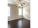 Bedroom with ceiling fan, neutral paint, and two windows for natural light at 2612 Beagle Landing Dr, Raleigh, NC 27610