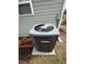A Goodman HVAC unit next to the home, surrounded by red mulch and greenery at 2612 Beagle Landing Dr, Raleigh, NC 27610