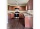 Kitchen featuring ample wood cabinets, stainless steel appliances, and laminate countertops at 2612 Beagle Landing Dr, Raleigh, NC 27610