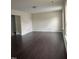 Spacious living room features hardwood floors, neutral paint, and natural light at 2612 Beagle Landing Dr, Raleigh, NC 27610