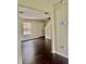 Open-concept living room with hardwood floors, neutral paint, and lots of sunlight at 2612 Beagle Landing Dr, Raleigh, NC 27610