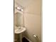 Powder room with pedestal sink, chrome fixtures, and modern lighting at 2612 Beagle Landing Dr, Raleigh, NC 27610