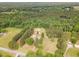 Expansive property with lush greenery and a secluded home, offering a peaceful retreat surrounded by nature at 2712 Nc 57, Hillsborough, NC 27278