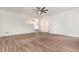 Spacious living room with new flooring, recessed lighting, and neutral paint, leading to other rooms in the house at 2712 Nc 57, Hillsborough, NC 27278